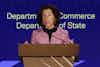 a woman standing at a podium